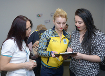 Делегации различных стран проходят аккредитацию на Кубок мира по прыжкам на батуте в Баку. Азербайджан, 3 март, 2016 